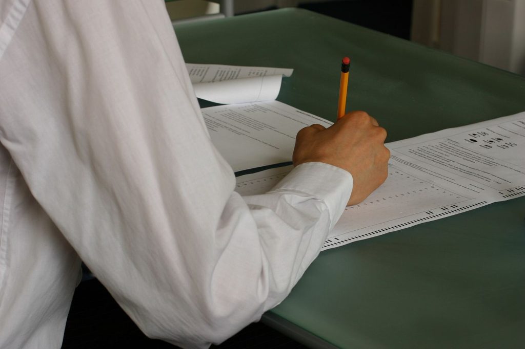 Expressive Writing Before Exams Reduces Performance Anxiety A student writing at a desk