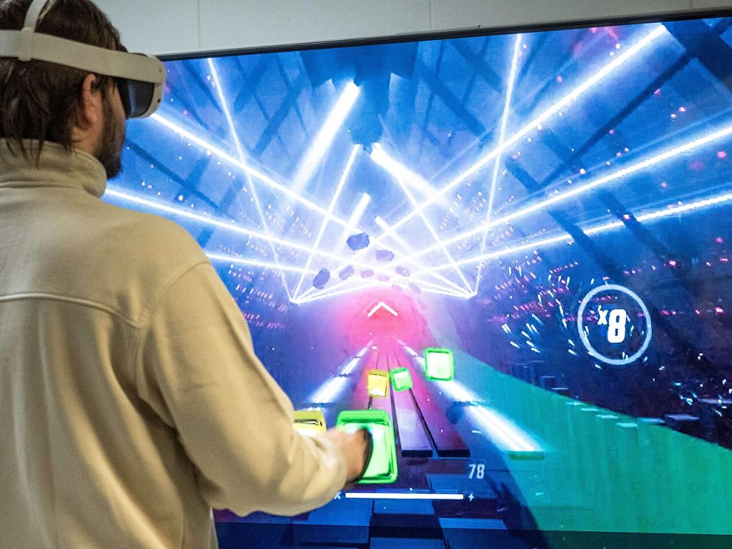 Virtuix and Meta Put VR Treadmills in the Same Box A person wearing a virtual reality headset and holding a controller