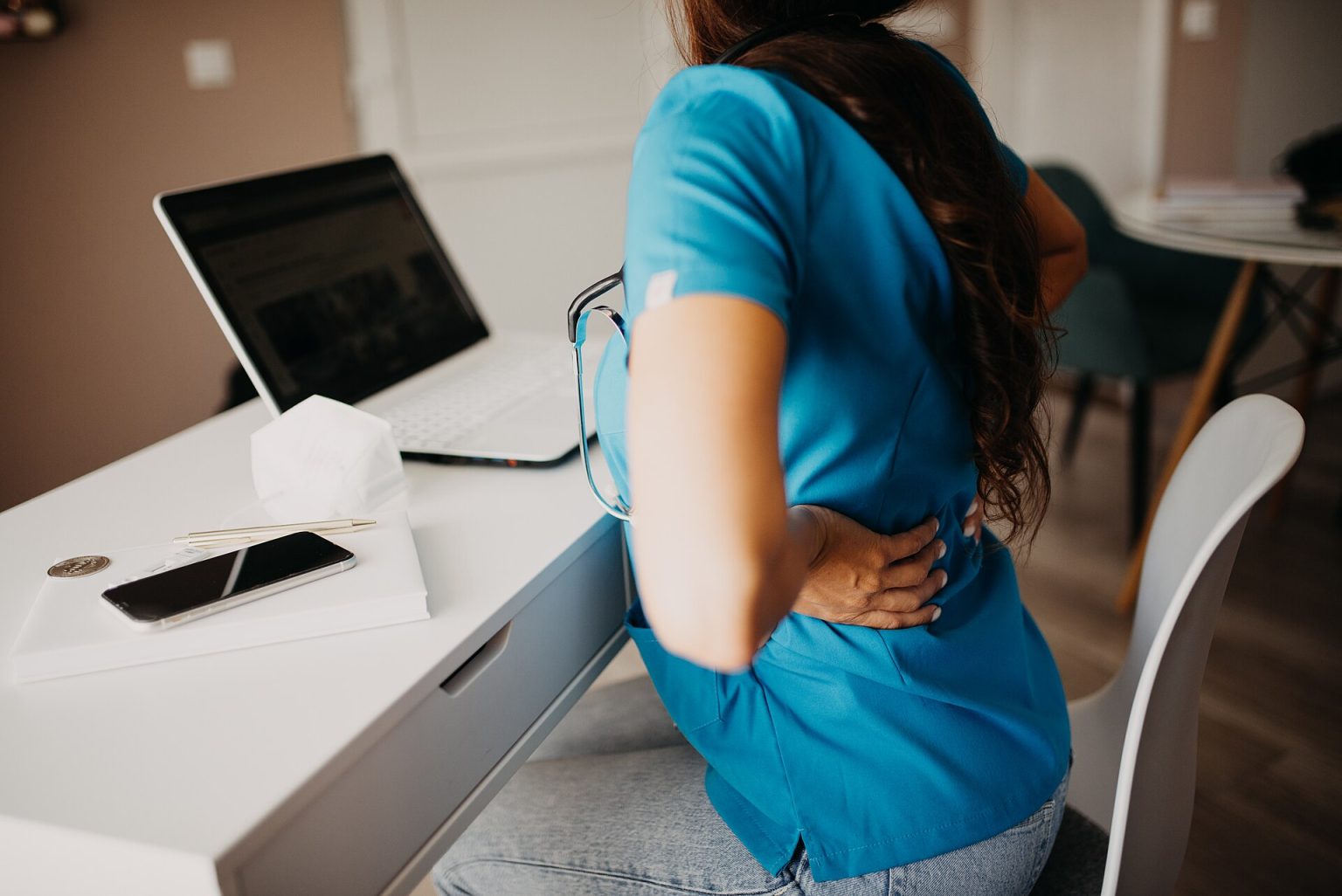 Five Years On, What Remote Work Data Really Shows A person working on a laptop at home beside a window